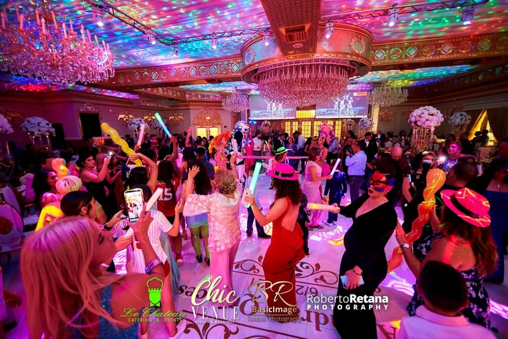 Guests dancing under colorful lights