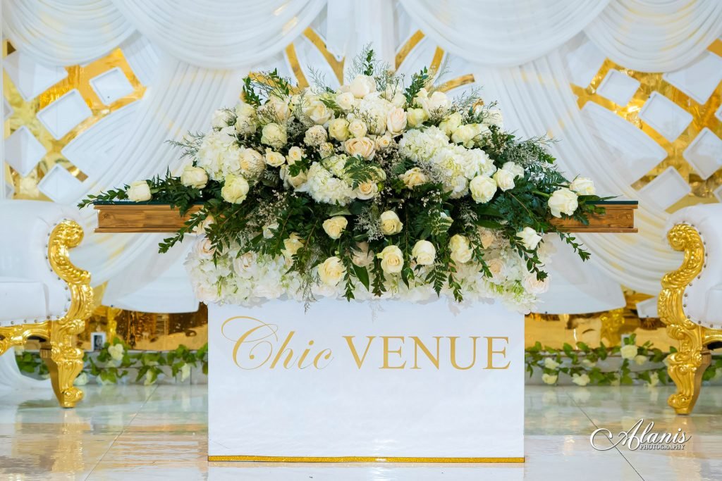 White floral arrangement with gold accents
