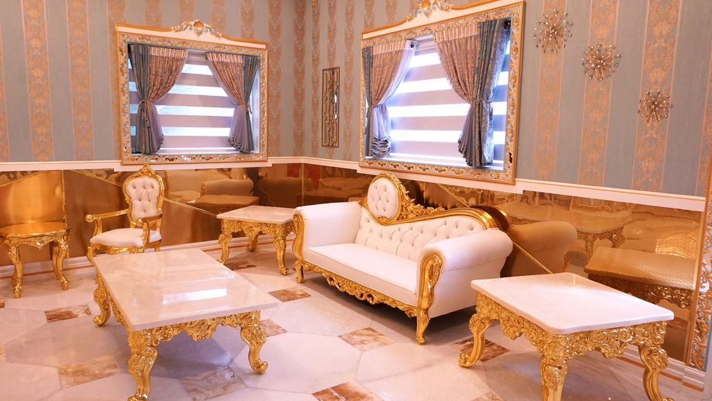 Private VIP room with gold-trimmed sofas